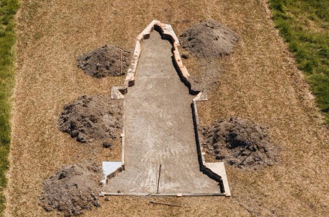 Installation view of Nicholas Galanin&#039;s An unmarked grave deep enough to bury colony and empire, 2024, Sculpture on the Gulf, Waheike Island, New Zealand, 2024
