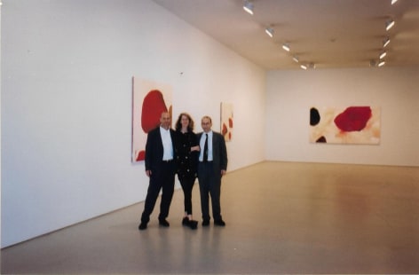 Peter Blum, Louise Belcourt, and friend, Installation of Paintings
