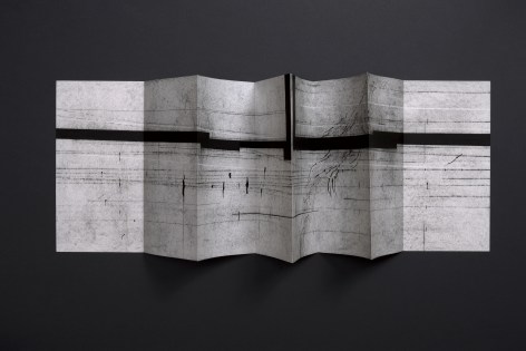 Seher Shah, Waves (V), 2024, Concertina handmade book with graphite dust, charcoal and ink on laid paper, 33 x 135 cm