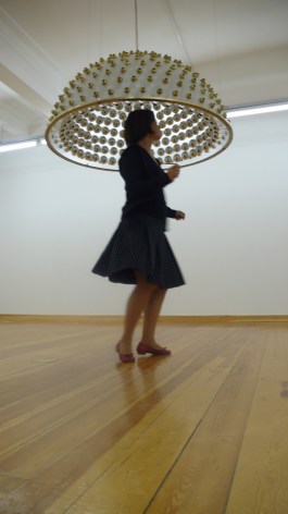 Hale Tenger, Dancing Queen, 2005, Plexiglass, brass, light builbs, motion sensor and audio