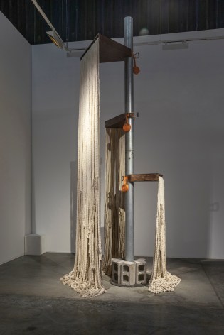 Afra Al Dhaheri, Give your weight to the ground (spiral staircase), 2023, Steel, stained wood, ratchet, cinderblock, and cotton ropes, 500 x 180 cm
