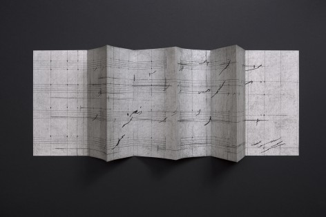 Seher Shah, Waves (III), 2024, Concertina handmade book with graphite dust, charcoal and ink on laid paper, 33 x 135 cm