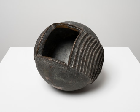 This is an image of a bronze sculpture made by Ruth Vollmer in 1964 titled: Wedding of a Sphere with Cube (Series I).