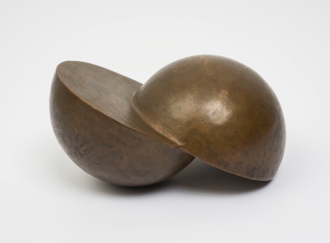 This is an image of a bronze sculpture made by Ruth Vollmer in 1966 titled: Skewed Hemispheres.