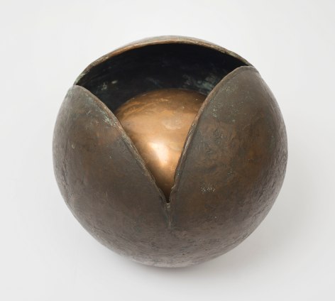 This is an image of a bronze sculpture made by Ruth Vollmer in 1965 titled: Rumblings Within.