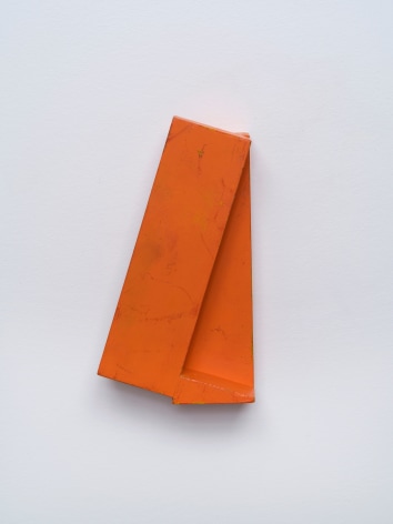 Joel Shapiro's untitled small red wall sculpture, c. 1978-80, made of wood and paint, 7 7/8 x 4 1/4 x 2 3/8 in. (20 x 10.8 x 6 cm).