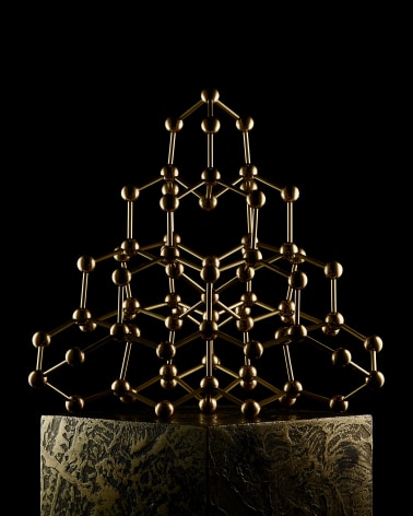 Fine mineral photograph of a brass Tetrahedrite molecular model for wilensky exquisite minerals habits exhibition.