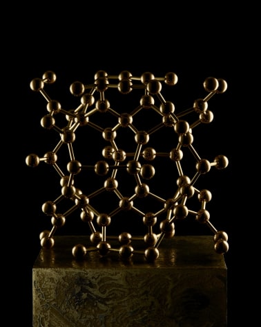 Fine Mineral photograph of a brass beryl molecular model for Wilensky Exquisite Minerals habits exhibition.