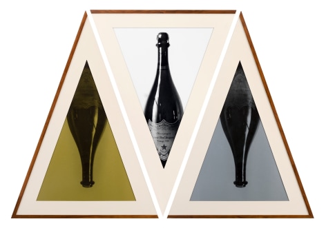 Geometric triptych of champagne bottles in triangular frames.