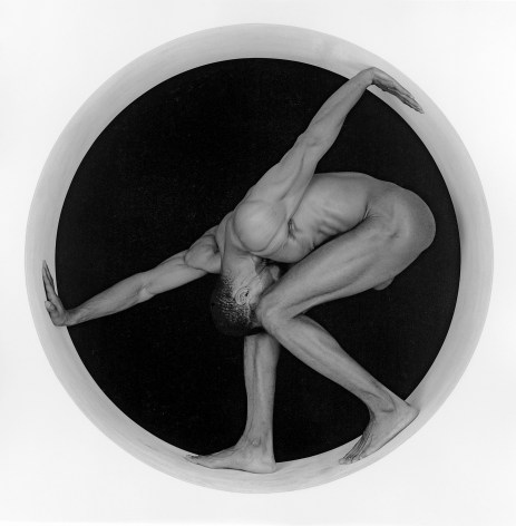 Black male nude posing in a circle.