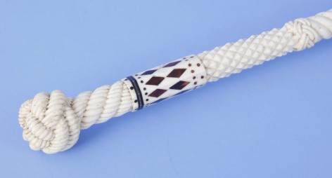 Whale ivory and whale bone cane with finely carved monkey fist and rope grip with  raised diamond and rope carved shaft, mid-19th century