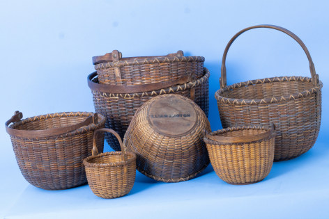 Nest of Seven Nantucket Baskets a few Branded and signed by &quot;William J. Rotch&quot;, American last quarter 19th Century,