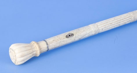 Whale ivory cane with a 12-sided petal grip with whale bone shaft with five carved sections, mid-19th century
