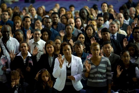 Citizen Ceremony For Dead Soldiers and Others in Harlem: Maria Alc&aacute;ntara, center, and her daughter Fredelinda Pe&ntilde;a, in striped sweater, took the citizenship oath for Ms. Alc&aacute;ntara&rsquo;s son, Cpl. Juan Alc&aacute;ntara, who died in Iraq, 2007.