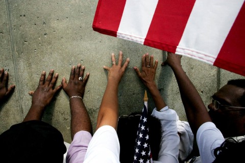 Emotions Rise at Levee Wall: On the Memorial Day holiday scores of people came to the Industrial Canal&rsquo;s Levee in New Orleans to remember the people who died here when Hurricane Katrina&rsquo;s arrival caused it to breech, May 5, 2005.