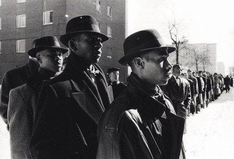 Fruit of Islam Confronts Gang Violence: Before breaking up into small groups, this gathering of Muslims from the Nation of Islam receive instructions before talking to young people in this public housing community in Chicago.