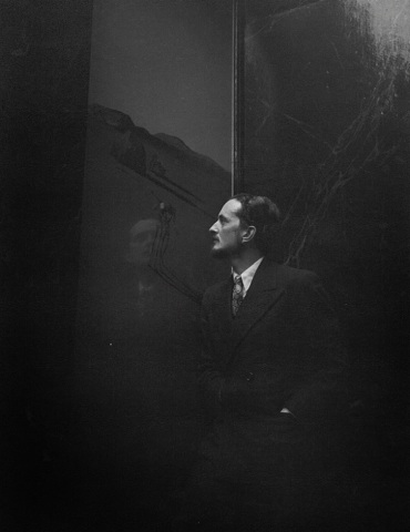 22. Cecil Beaton (British, 1904- 1980),&nbsp;Edward James Gazing at Dali Painting, c. 1937, Gelatin Silver Print, 16&rdquo; x 11.5&rdquo;