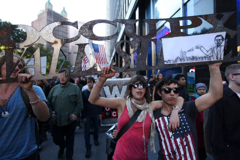 OWS March in Downtown Manhattan: Occupy Wall Street demonstrators march down Broadway in Lower Manhattan, 2011.