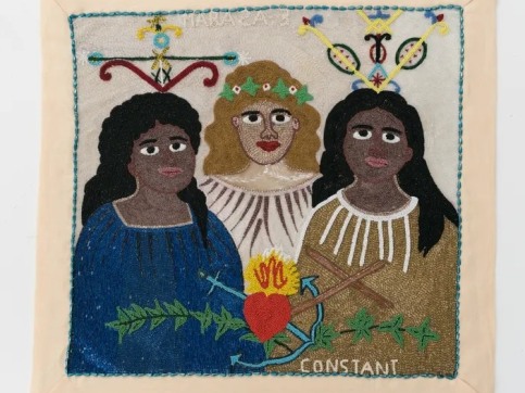 Beaded flag depicting 3 women and Vodou symbols