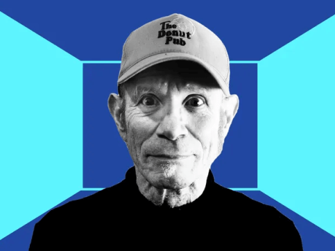 black and white photo portrait of the artist Charles Atlas on a blue background
