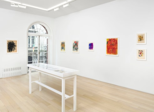 installation view with framed drawings