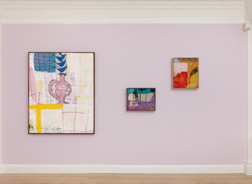 installation view of abstract paintings in multiple colors on burlap