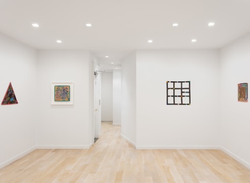 installation view with 4 geometric abstract paintings by Alan Shields