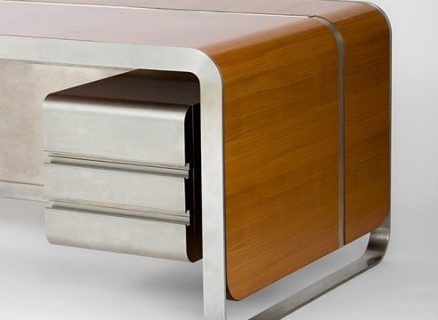 Detail of wood topped metal desk with metal frame and drawers