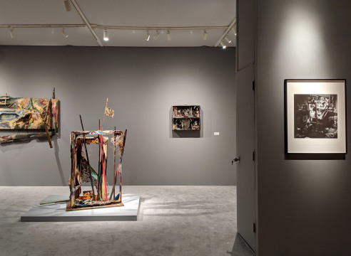 Art fair booth featuring sculpture and paintings by Carolee Schneemann