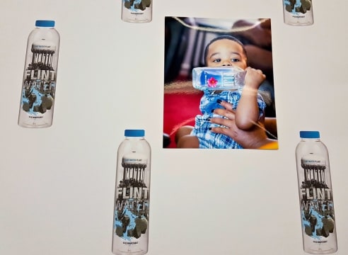 Pope.L’s Conceptual Bottled Water Project Calls Attention to the Crisis in Flint