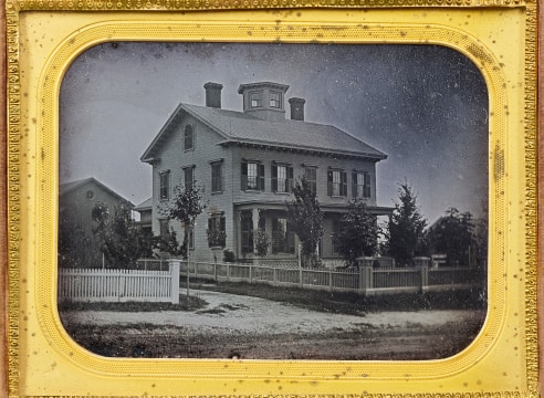 Cased Half Plate Daguerreotype Featuring a Fine House with Cupola and a White Picket Fence, American circa 1850
