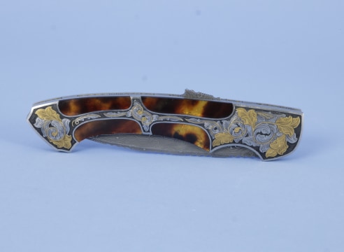 Engraved and Gold Filled Automatic Knife by Joe Kious.