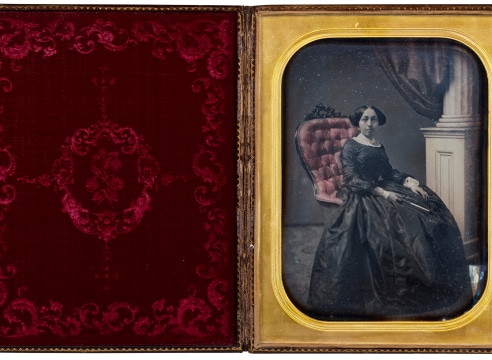 Polychrome Full Plate Daguerreotype Depicting A Women in a Highback Chair with the Original Case, American Circa 1850