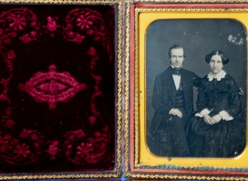 Quarter Plate Daguerreotype Of a Man and woman, pictured seated with the man's arm around her. Gilt accented jewery. Embossed velvet case interior with &quot;Brady's Gallery 359 Broadway New York&quot;