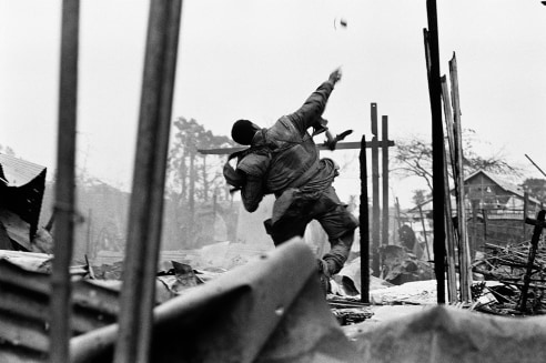 Don McCullin, US Marine Hurling a Grenade Seconds before Being Shot through the Left Hand, Hue, Vietnam, 1968, Howard Greenberg gallery, 2019 