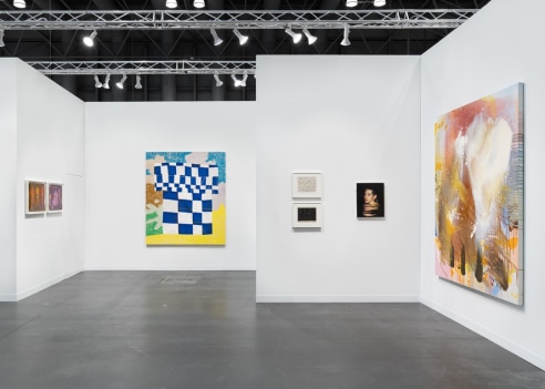 image of a art fair booth with multiple artworks