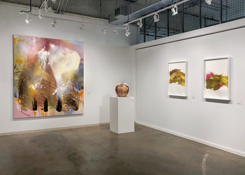 installation view with various artworks