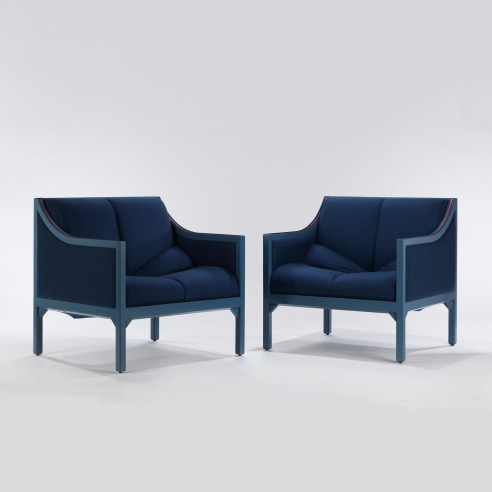 PAIR OF PAULIN CHAIRS BLUE AND PINK SITTING NEXT TO EACHOTHER