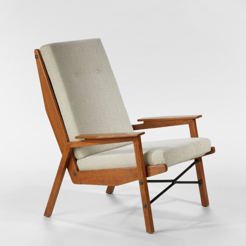 Chair with white upholstery and brown wooden body. 