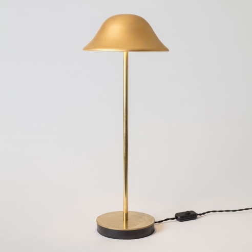 minimal gold lamp in an empty room