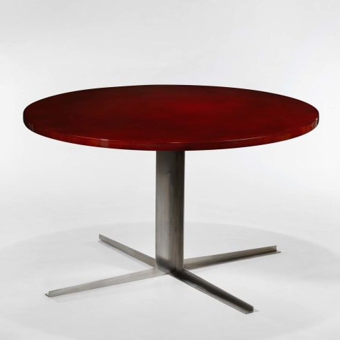 photograph of a red table in a white room