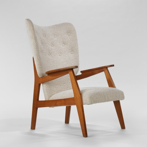 white boucle upholstery with brown wooden structure chair. by RJC