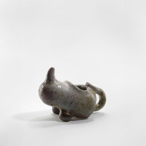 photograph of a zoomorphic rhinoceros dish in an empty room 
