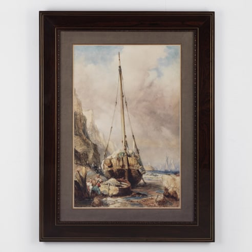 Framed watercolor depicting a beached sailboat and small boat next to a cliffside