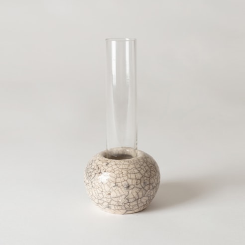 Glass Vase in raku rounded container. Glass is clear and ceramic is off white. 