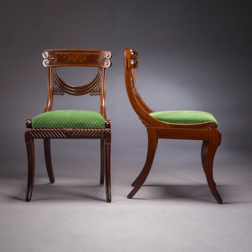 Set of Twelve Klismos-form Dining Chairs, about 1815–20. Attributed to Isaac Vose & Son (active 1819–25), with Thomas Seymour (1772–1848), as foreman (active in the Vose shop, 1819–25), Boston. Mahogany with upholstered slip seats Each: 34 in. high, 18 13/16 in. wide, 23 1/8 in. deep (overall).