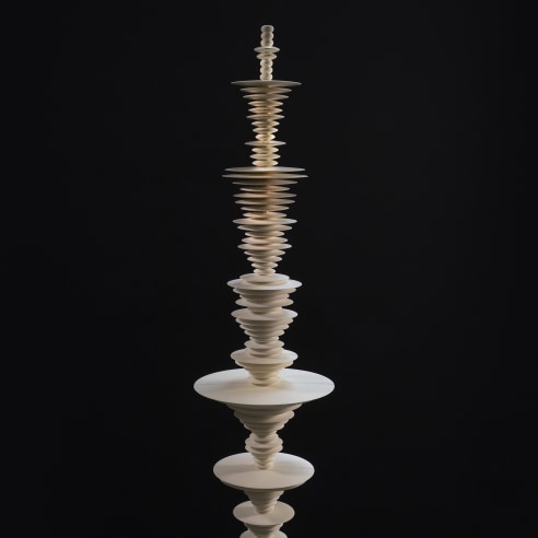 a sculpture by Elizabeth Turk of 3D-printed discs stacked and arranged to simultaneously resemble a Modernist abstraction and a sound wave