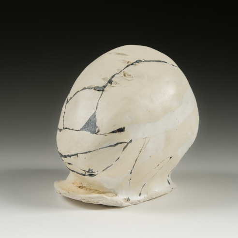 a sculpture by Maria Elena Gonzalez called Head that is made of ceramic plaster and epoxy which is 4 3/4 in high x 3 3/4 in. wide and 5 inches deep overall