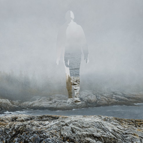 An image of a figure emerging from fog above water and rocks, by Colin Hunt, in egg tempera paint 
