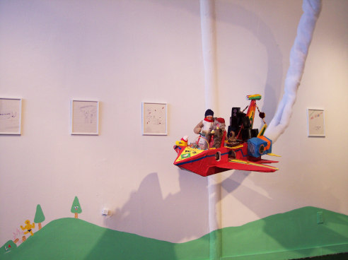 Paper-made jet plane flying through gallery